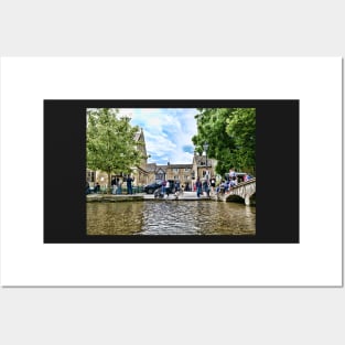 Japanese Akita dog in the river, Bourton-on-the-Water village Posters and Art